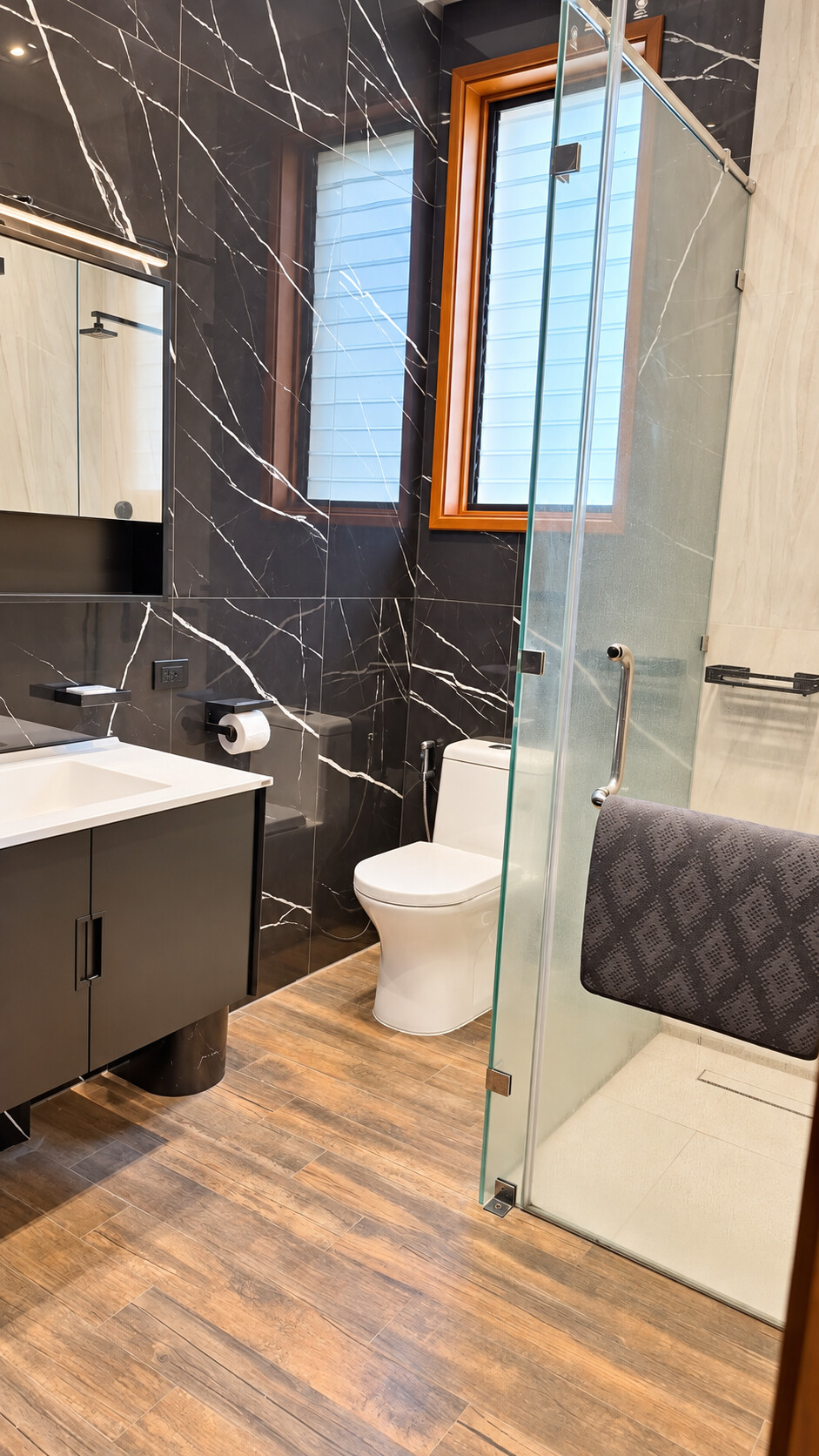 Bathroom — black marble, glass shower